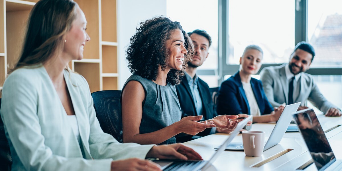 group of people sitting at a conference table